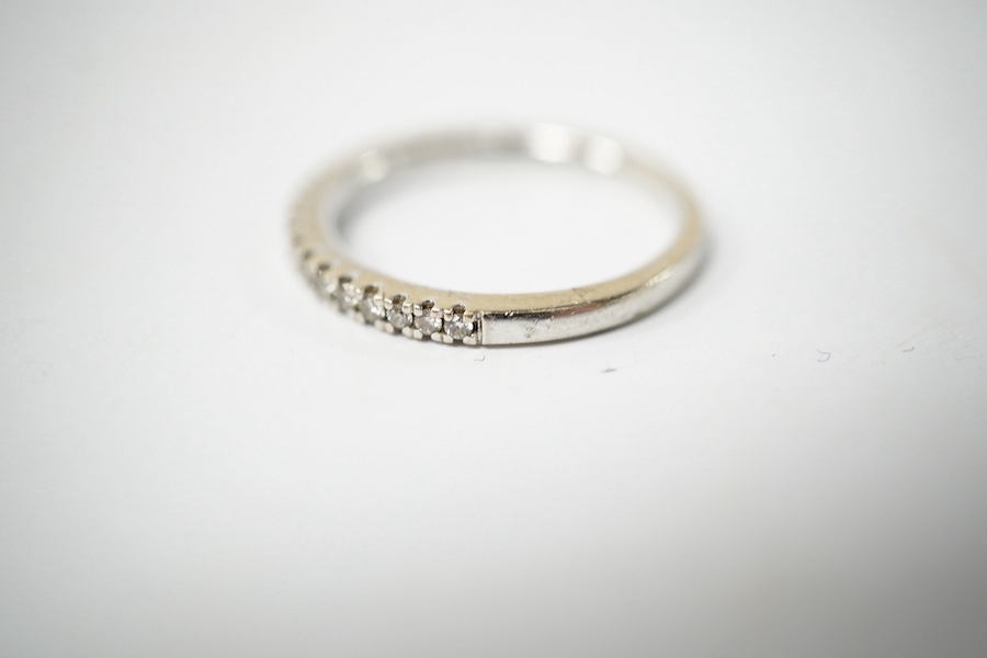 A modern Vera Wang 18ct white gold and diamond chip set half eternity ring, size K, gross weight 2.6 grams. Condition - good